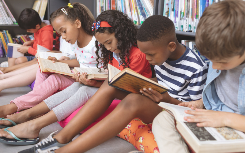 Children enjoying the cognitive benefits of reading