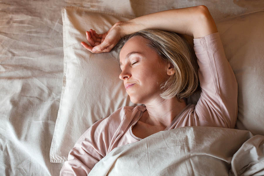 woman supporting brain health with quality sleep